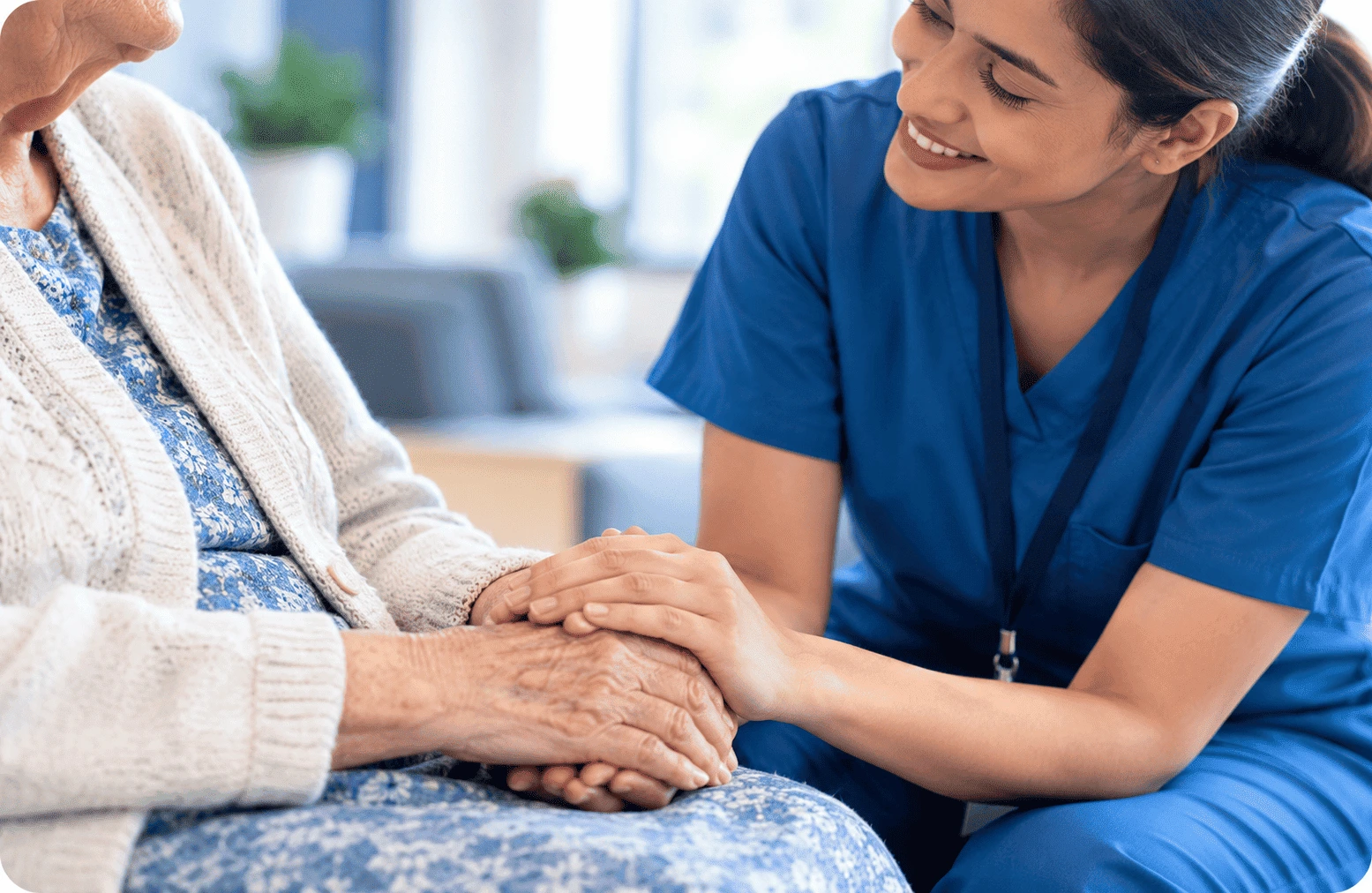 Two people holding hands in a moment of comfort